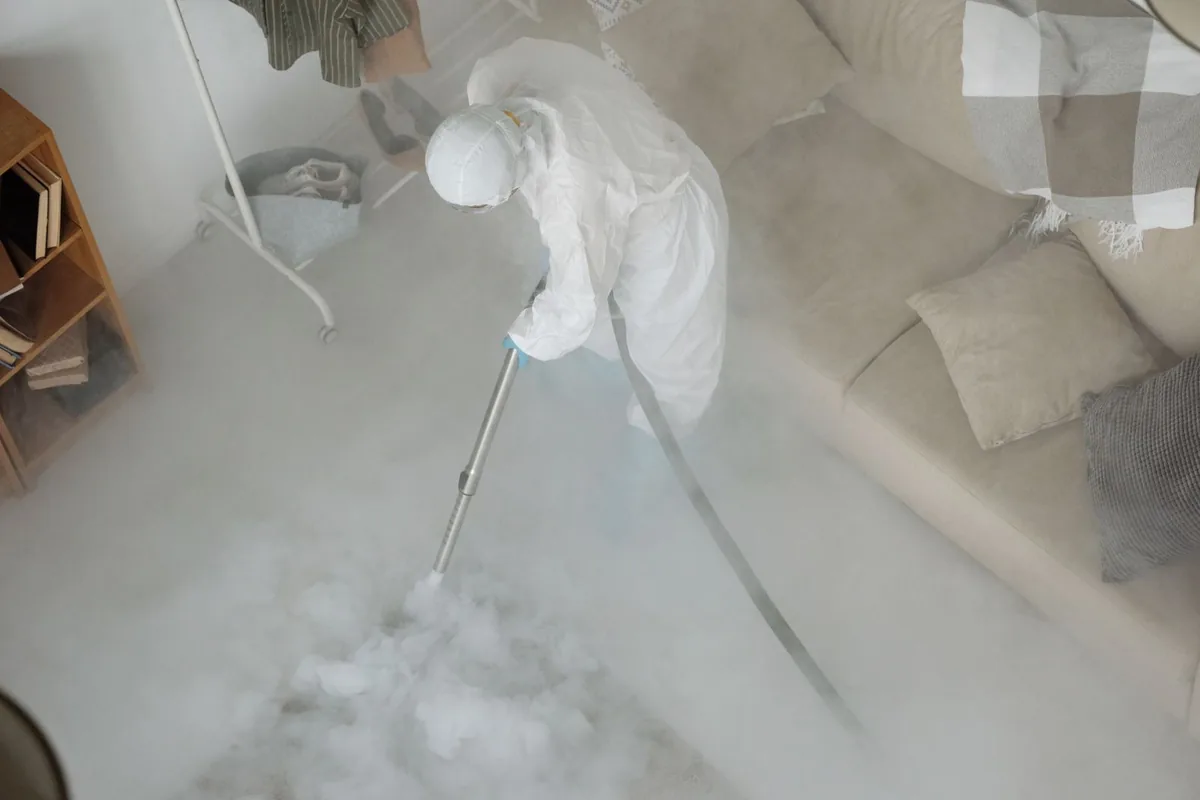 Biohazard cleanup technician in protective equipment, Hillsdale, NJ